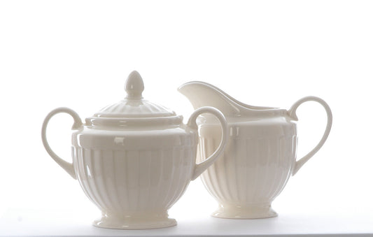 Cream ironstone matching milk jug and sugar bowl
